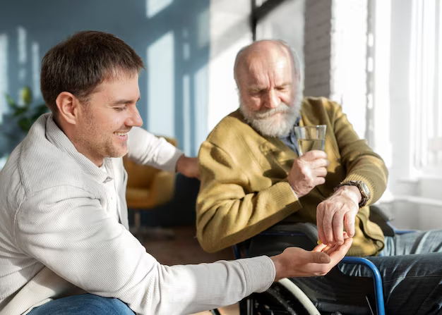 Doctor giving pills to patient