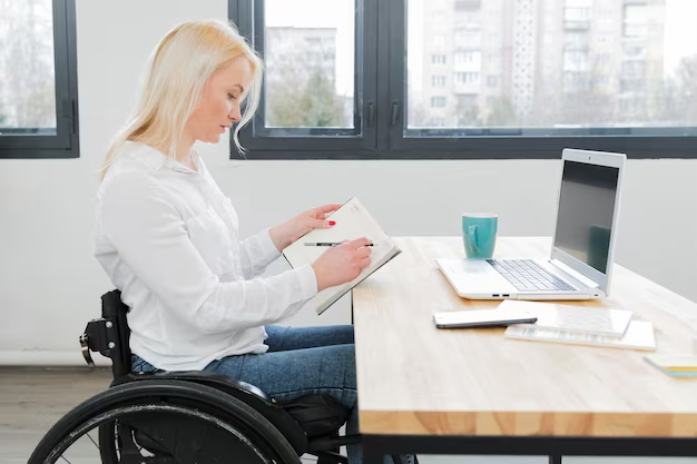 Woman in a wheelchair in the office